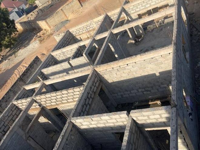 The ground-floor blockwork at Jabang seen from above, the room divisions built up and the concrete ring beam cast along the wall tops.