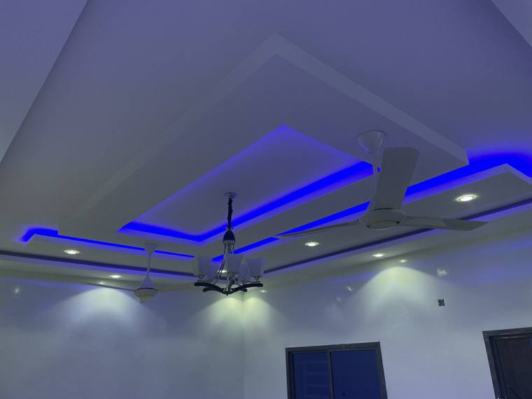 A second coffered ceiling with concealed LED lighting to the perimeter of each panel.